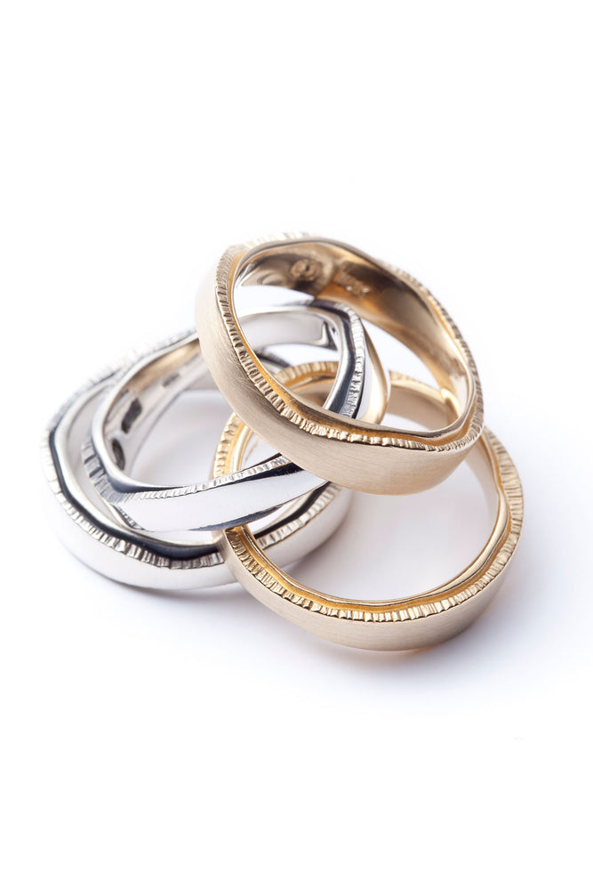 Women's and men's wedding rings, set in 18-carat yellow gold and sterling silver