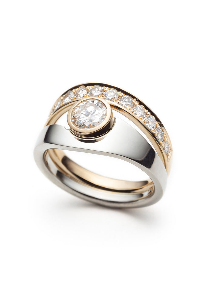 19-carat white gold, 18-carat yellow gold women's engagement ring, 	set with diamonds