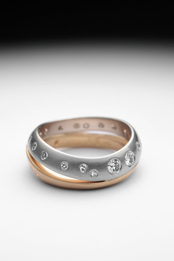18-carat yellow and white gold band, set with diamonds